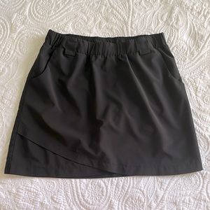 RBX activewear skort, everyday athletic, modest length with pockets.